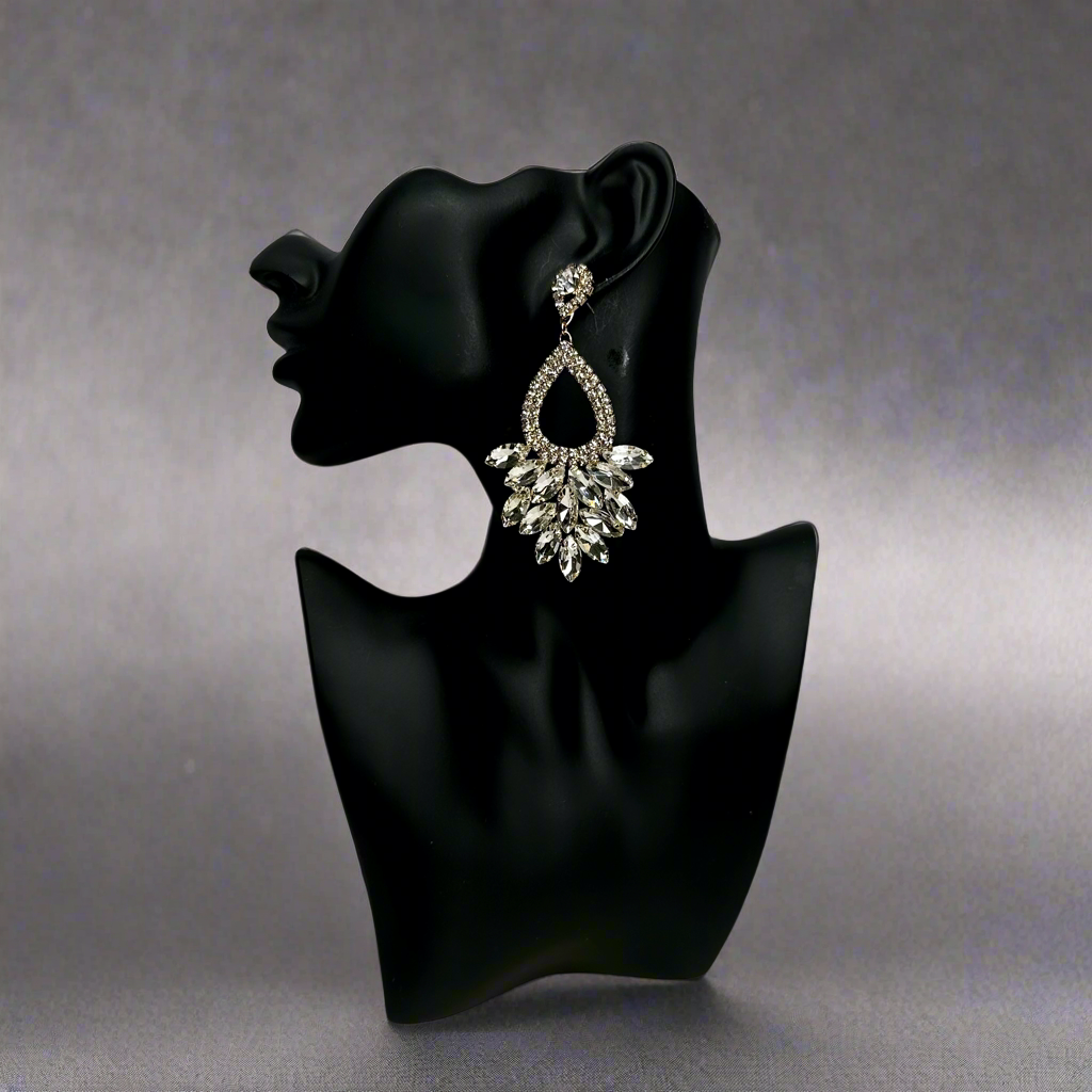solver rhinestone earrings on a black mannequin against a blackish gray background