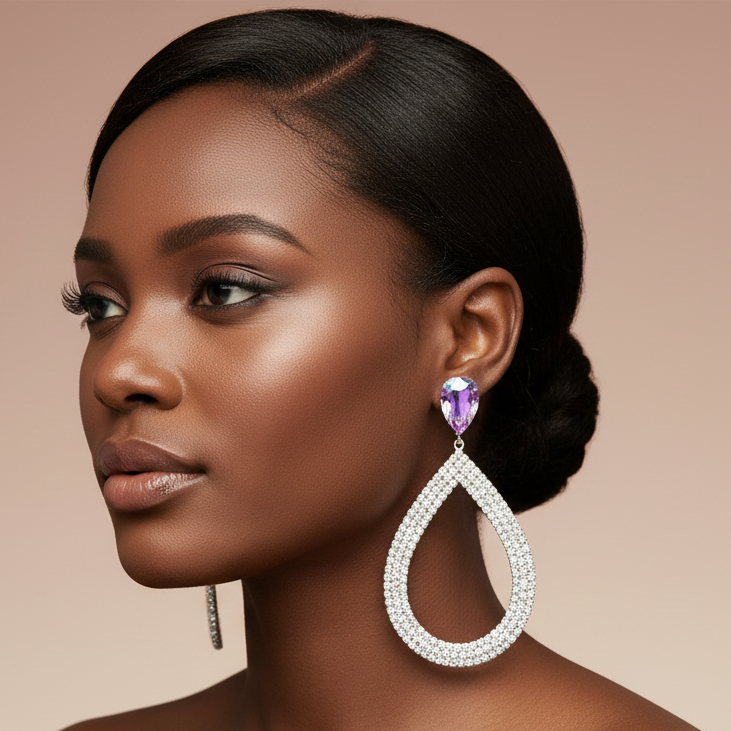 large teardrop Earring on a mannequin ear with a gray background